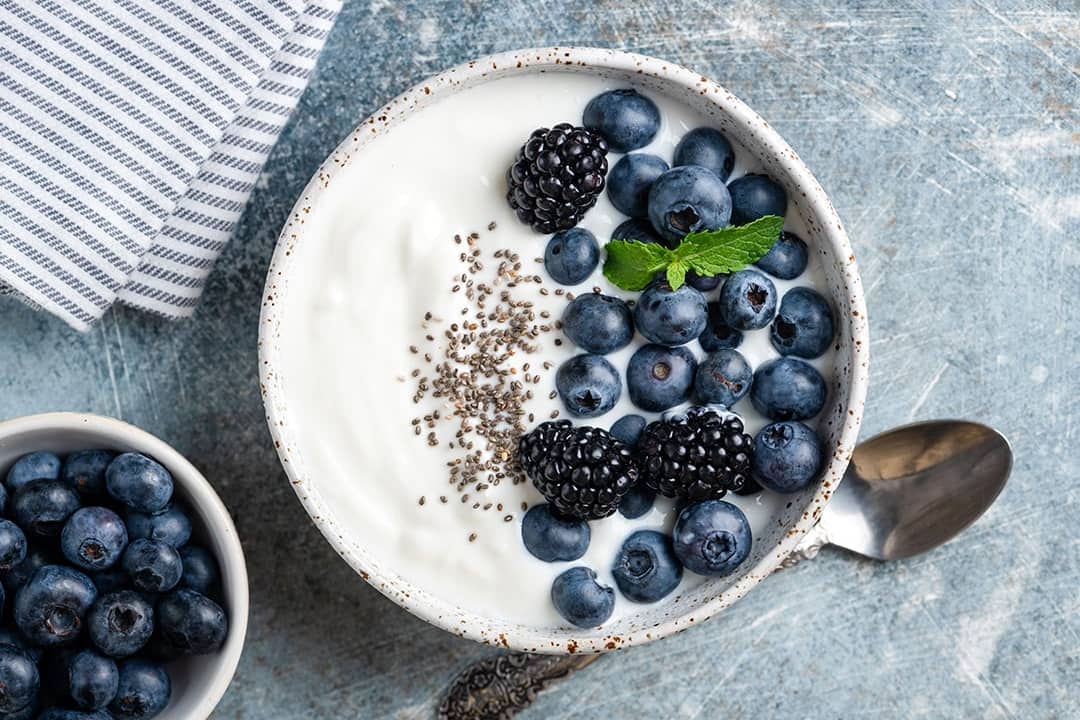 Greek yogurt bowl with blueberries, blackberries and chia seeds. 